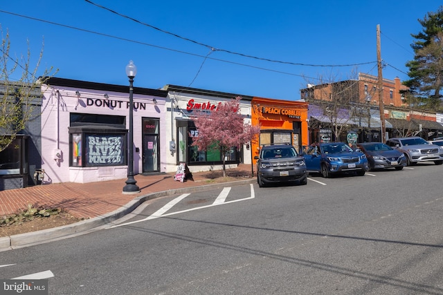 view of commercial location featuring uncovered parking