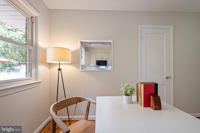 home office with plenty of natural light and baseboards