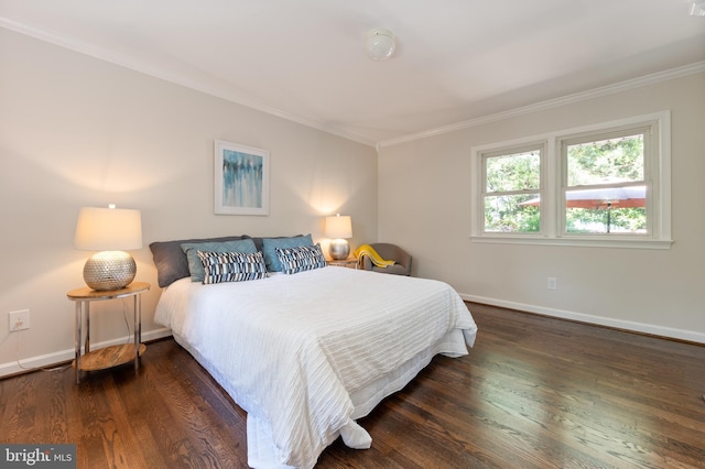 bedroom featuring ornamental molding, baseboards, and dark wood-style floors