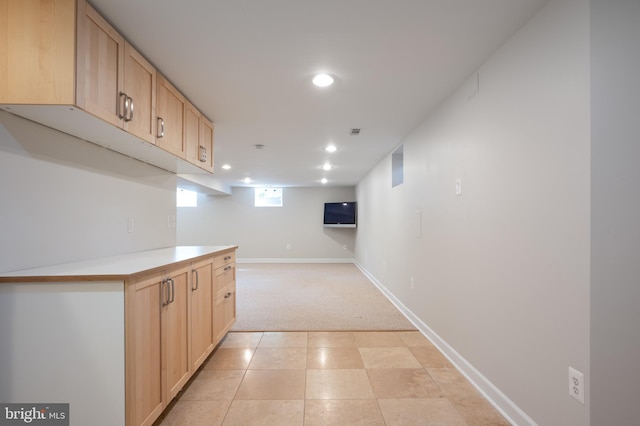 hall featuring recessed lighting, light colored carpet, and baseboards