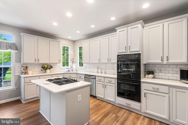 27 Avalon Rd, Pennington, NJ 08534 - kitchen featuring stainless steel appliances, a sink, white cabinets, light countertops, and backsplash