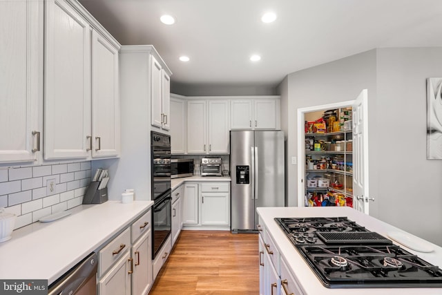 27 Avalon Rd, Pennington, NJ 08534 - kitchen featuring stainless steel appliances, decorative backsplash, light countertops, white cabinets, and recessed lighting