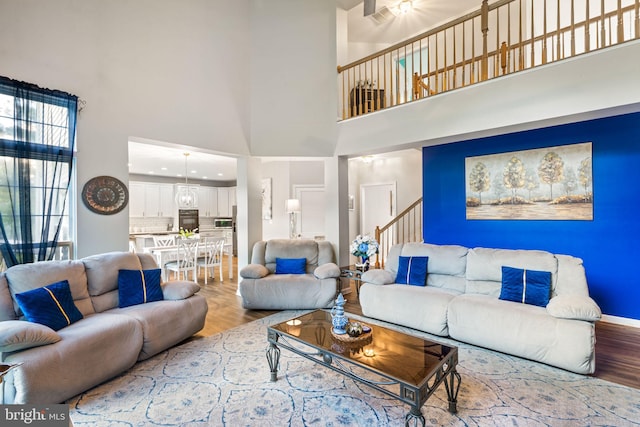 27 Avalon Rd, Pennington, NJ 08534 - living area featuring light wood-style floors, a towering ceiling, and stairway