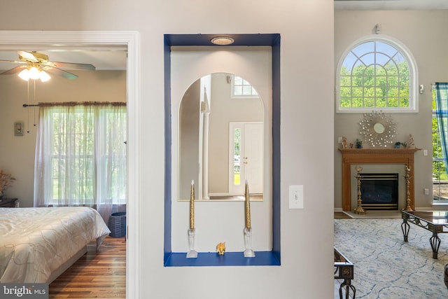 27 Avalon Rd, Pennington, NJ 08534 - bedroom with arched walkways, wood finished floors, and a glass covered fireplace