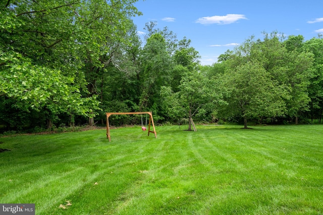 27 Avalon Rd, Pennington, NJ 08534 - view of green lawn featuring a playground