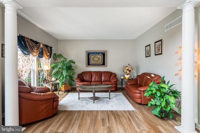 27 Avalon Rd, Pennington, NJ 08534 - living room with decorative columns and wood finished floors