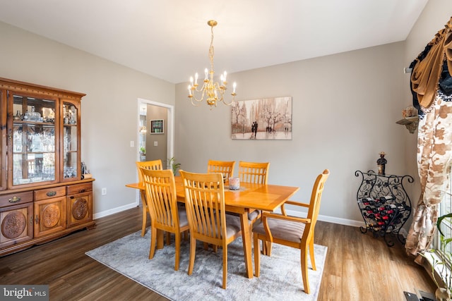 27 Avalon Rd, Pennington, NJ 08534 - dining room featuring a chandelier, wood finished floors, and baseboards