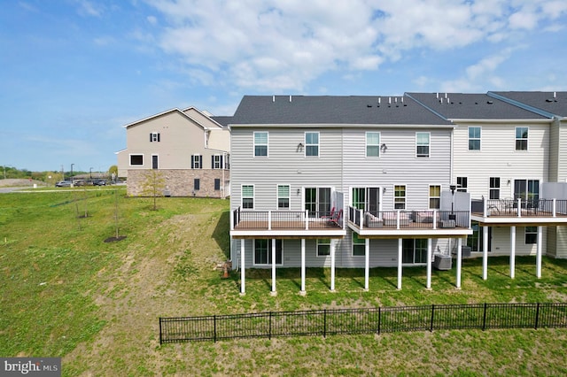 back of property featuring cooling unit and a deck