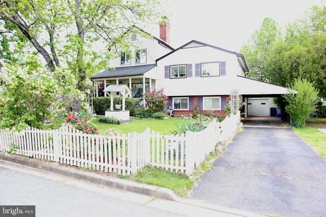 1517 Margaret St, Woodbridge, VA 22191 - view of front of home featuring a chimney, asphalt driveway, and an attached garage