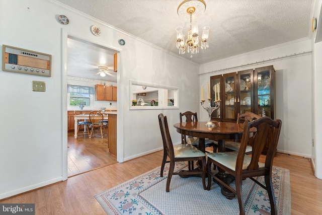 1517 Margaret St, Woodbridge, VA 22191 - dining room with ornamental molding, light wood finished floors, a textured ceiling, a chandelier, and a ceiling fan