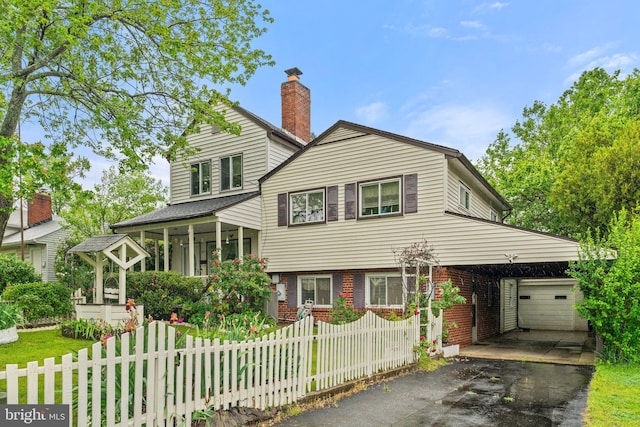 1517 Margaret St, Woodbridge, VA 22191 - tri-level home featuring asphalt driveway, a garage, brick siding, and a chimney