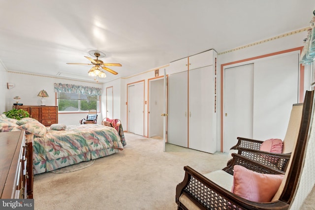 1517 Margaret St, Woodbridge, VA 22191 - bedroom featuring light colored carpet, multiple closets, and a ceiling fan