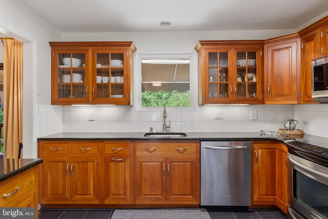 16 Lacosta Ct, Towson, MD 21204 - bar area featuring appliances with stainless steel finishes, a sink, decorative backsplash, and dark tile patterned floors
