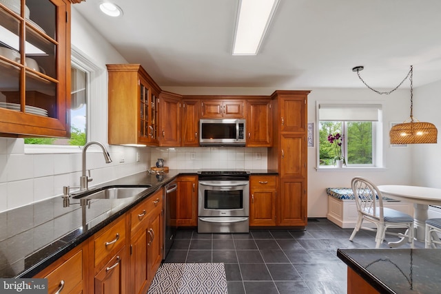 16 Lacosta Ct, Towson, MD 21204 - kitchen with appliances with stainless steel finishes, a sink, brown cabinets, and recessed lighting