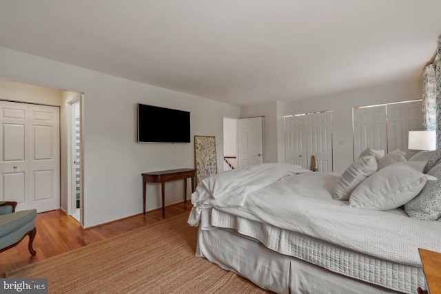 16 Lacosta Ct, Towson, MD 21204 - bedroom featuring multiple closets, wood finished floors, and baseboards