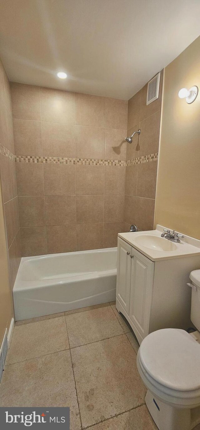 full bath with toilet,  shower combination, tile patterned flooring, vanity, and recessed lighting