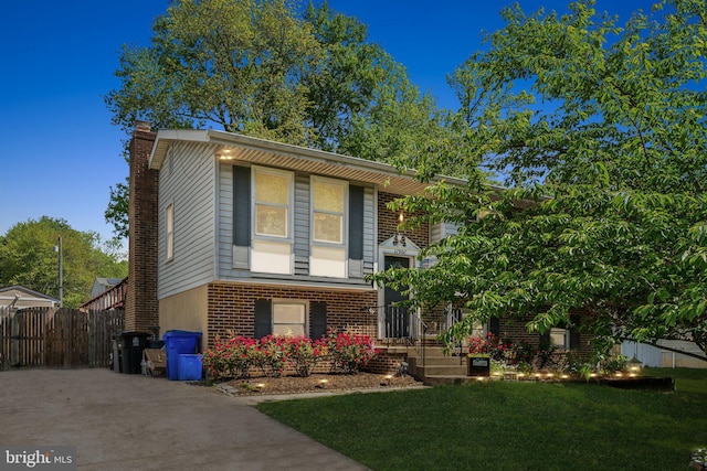 12906 7th St, Bowie, MD 20720 - bi-level home featuring a chimney and brick siding