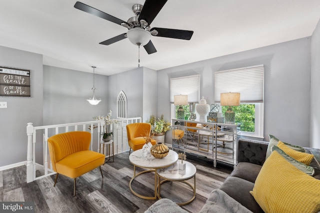 12906 7th St, Bowie, MD 20720 - living area featuring ceiling fan, wood finished floors, baseboards, and an upstairs landing