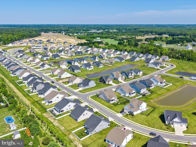 aerial perspective of suburban area featuring a nearby body of water
