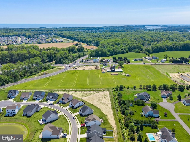 aerial view of residential area featuring a heavily wooded area