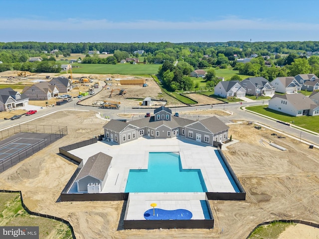 aerial view of residential area with a pool area