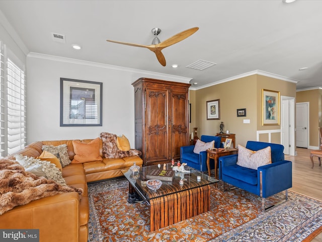 living room featuring a ceiling fan, light wood-style flooring, crown molding, and recessed lighting