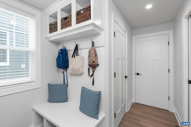 mudroom with wood finished floors, baseboards, and recessed lighting