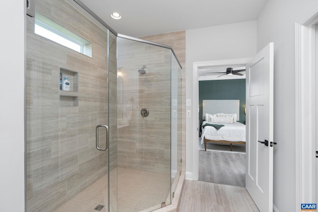 full bath featuring ceiling fan, ensuite bath, a shower stall, wood finished floors, and recessed lighting