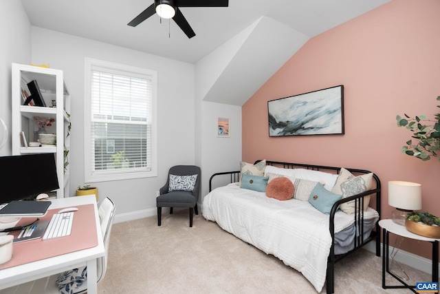 carpeted bedroom featuring baseboards, a ceiling fan, and a desk