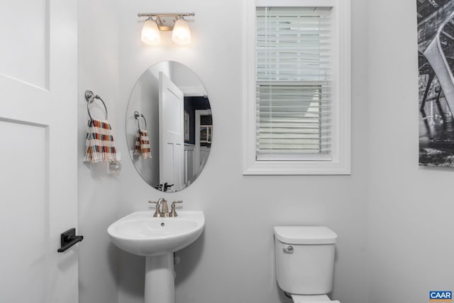 bathroom featuring toilet and a sink