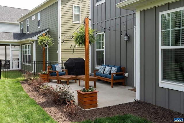 view of patio with grilling area, fence, and an outdoor hangout area