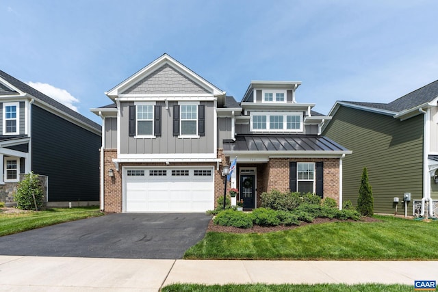 craftsman inspired home with brick siding, driveway, a garage, board and batten siding, and a front yard