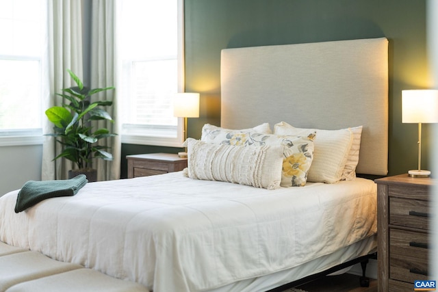 bedroom with multiple windows