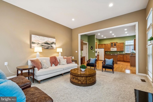 229 Bowen Ct, Annapolis, MD 21401 - living area with recessed lighting, baseboards, light colored carpet, and light wood-type flooring