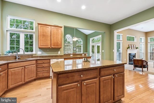229 Bowen Ct, Annapolis, MD 21401 - kitchen with a sink, dishwasher, light wood finished floors, stone countertops, and recessed lighting