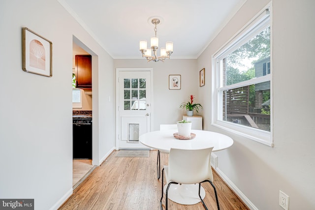 2015 Rollins Dr, Alexandria, VA 22307 - dining room featuring a chandelier, light wood finished floors, ornamental molding, and baseboards