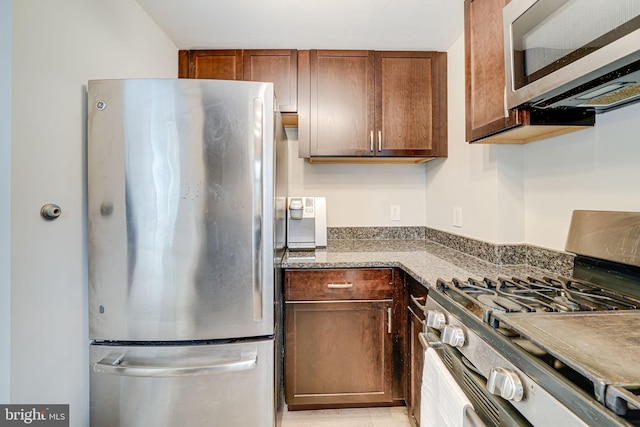 2015 Rollins Dr, Alexandria, VA 22307 - kitchen with appliances with stainless steel finishes and stone counters