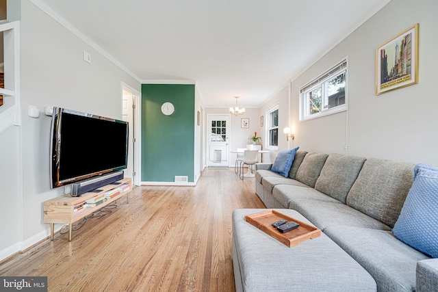 2015 Rollins Dr, Alexandria, VA 22307 - living area featuring a chandelier, light wood-style flooring, crown molding, and baseboards
