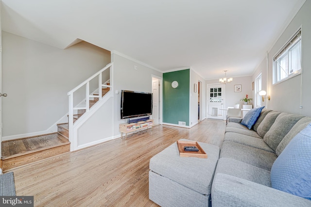 2015 Rollins Dr, Alexandria, VA 22307 - living room with light wood-style floors, stairway, and a chandelier