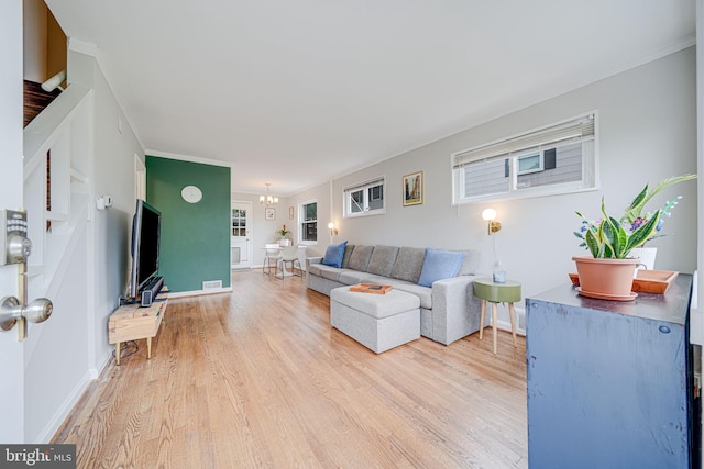 2015 Rollins Dr, Alexandria, VA 22307 - living area featuring wood finished floors, baseboards, plenty of natural light, and ornamental molding