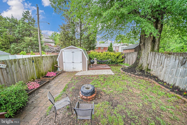 2015 Rollins Dr, Alexandria, VA 22307 - fenced backyard with a shed, an outbuilding, and a patio area