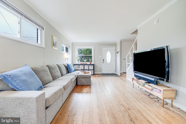 2015 Rollins Dr, Alexandria, VA 22307 - living room with wood finished floors, crown molding, baseboards, and stairs