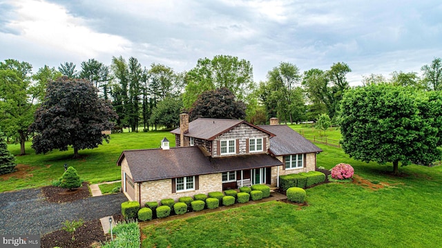 3019 Level Rd, Churchville, MD 21028 - view of front of property with a chimney, a front yard, a shingled roof, view of wooded area, and brick siding