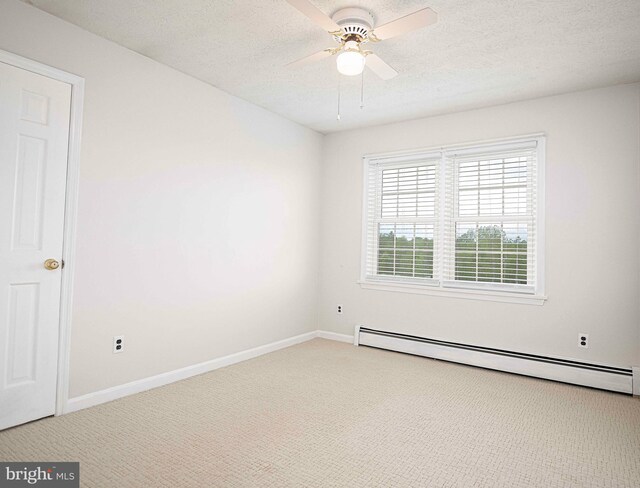 3019 Level Rd, Churchville, MD 21028 - spare room with baseboard heating, carpet flooring, a ceiling fan, baseboards, and a textured ceiling