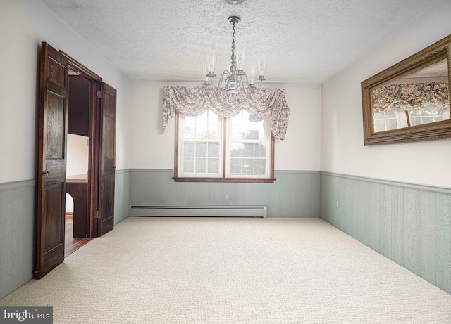 3019 Level Rd, Churchville, MD 21028 - unfurnished dining area featuring a baseboard heating unit, a chandelier, a wainscoted wall, carpet floors, and a textured ceiling