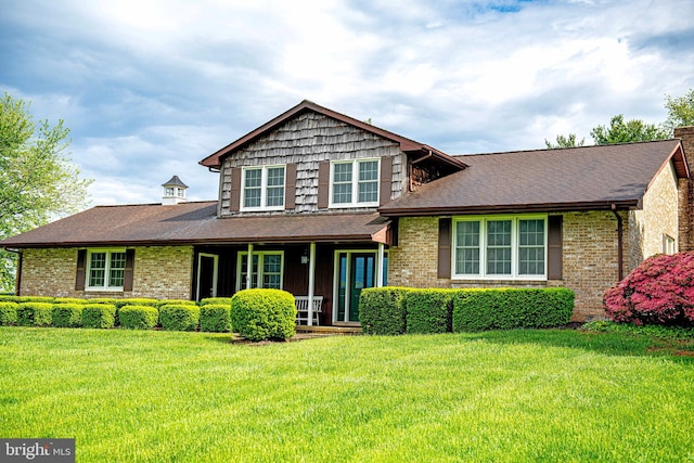 3019 Level Rd, Churchville, MD 21028 - view of front of home featuring covered porch, brick siding, a front yard, and a shingled roof