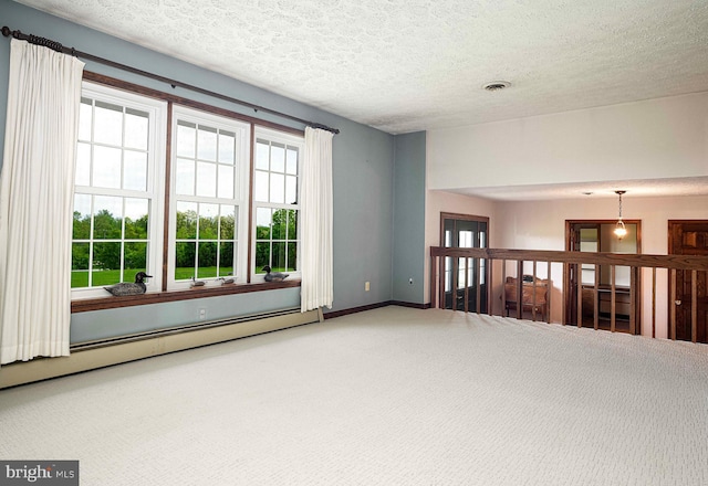 3019 Level Rd, Churchville, MD 21028 - spare room featuring baseboard heating, plenty of natural light, carpet floors, a textured ceiling, and baseboards