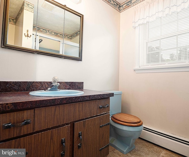 3019 Level Rd, Churchville, MD 21028 - bathroom featuring baseboard heating, tile patterned flooring, vanity, and toilet
