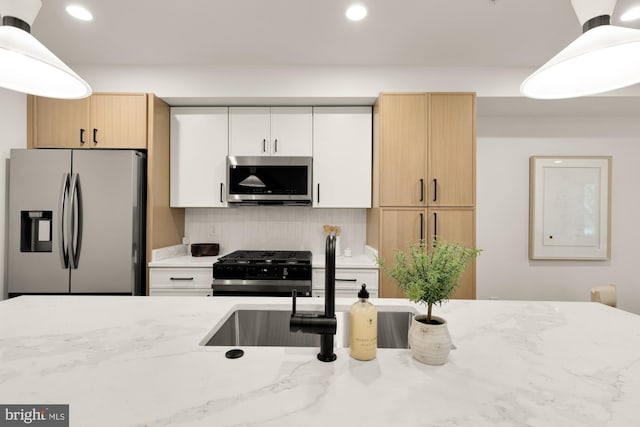 kitchen with stainless steel appliances, light stone countertops, recessed lighting, pendant lighting, and decorative backsplash