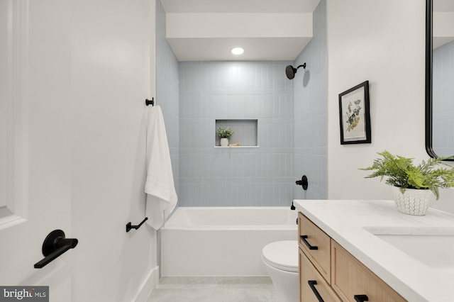 bathroom featuring vanity,  shower combination, toilet, and baseboards